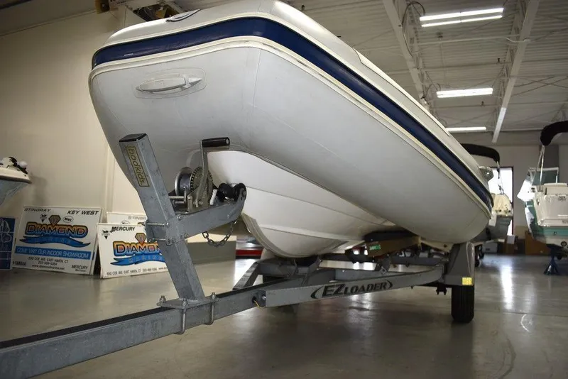 Slide: The Image of 2018 Mercury 460 Ocean Runner Rib Inflatable boat on trailer in indoor storage. - 22