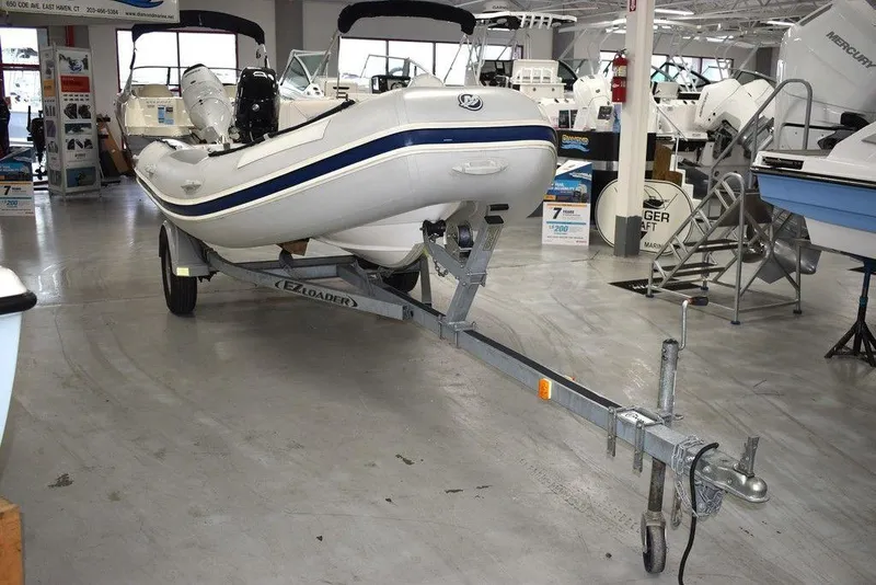 Slide: The Image of 2018 Mercury 460 Ocean Runner Rib Inflatable boat on trailer in showroom. - 3