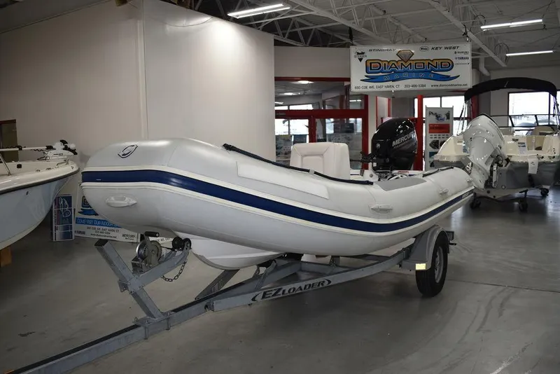 Slide: The Image of 2018 Mercury 460 Ocean Runner Rib Inflatable boat on trailer in showroom. - 4