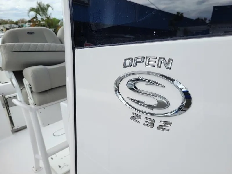 Slide: The Image of 2025 Sportsman Open 232 boat interior with logo detail. - 11