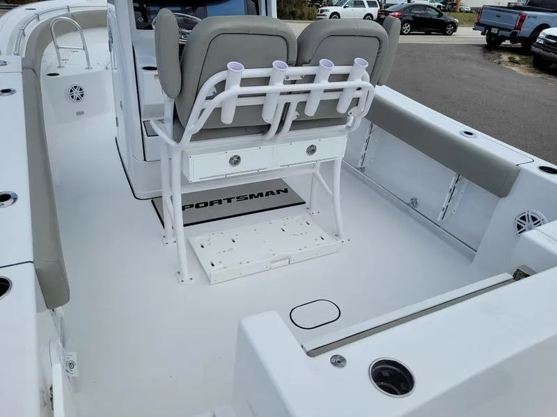 Slide: The Image of 2025 Sportsman Open 232 boat interior with seating and rod holders. - 5