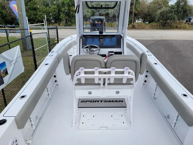 Slide: The Image of 2025 Sportsman Open 232 boat interior with dual seats and navigation console. - 6