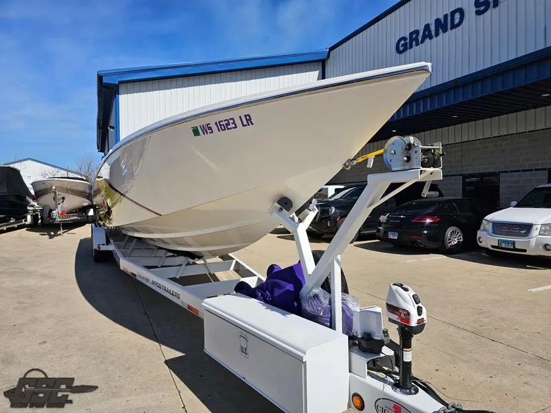 Slide: The Image of 2003 Cigarette 42 Tiger boat on trailer outside dealership. - 15