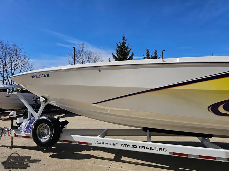 Slide: The Image of 2003 Cigarette 42 Tiger boat on Myco trailer under clear blue sky. - 19