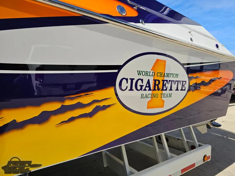 Slide: The Image of 2003 Cigarette 42 Tiger boat with vibrant racing team graphics. - 25