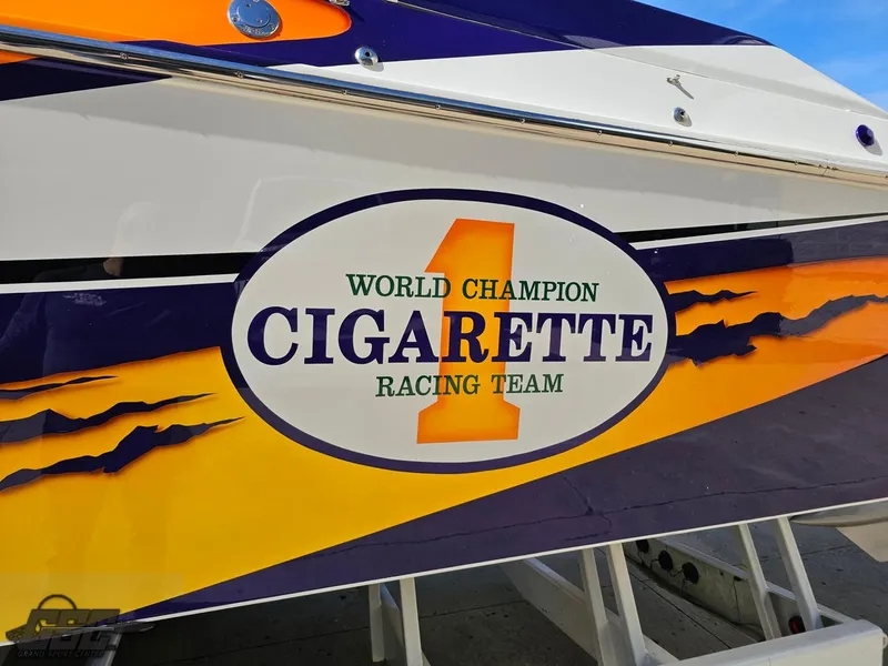 Slide: The Image of 2003 Cigarette 42 Tiger boat with "World Champion Racing Team" logo. - 26