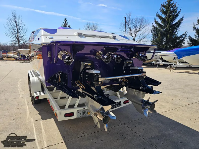 Slide: The Image of 2003 Cigarette 42 Tiger boat on trailer, rear view with dual propellers. - 38