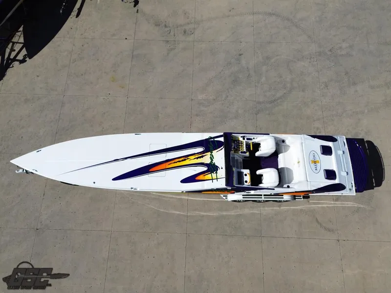 Slide: The Image of Aerial view of 2003 Cigarette 42 Tiger speedboat with vibrant graphics. - 44