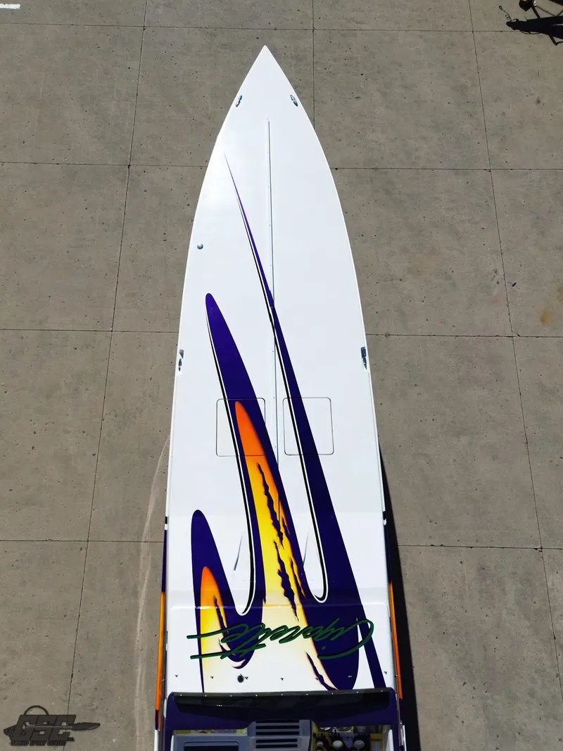 Slide: The Image of 2003 Cigarette 42 Tiger boat with vibrant graphics on deck. - 48