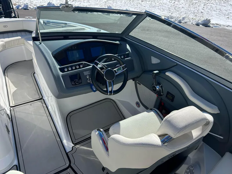 Slide: The Image of 2020 Cobalt R5 Surf boat cockpit with modern steering and controls. - 12