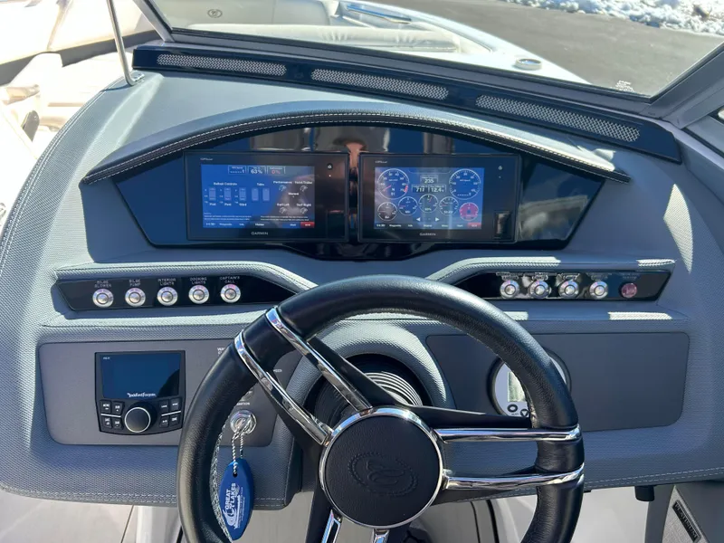 Slide: The Image of 2020 Cobalt R5 Surf boat dashboard with modern controls and steering wheel. - 19