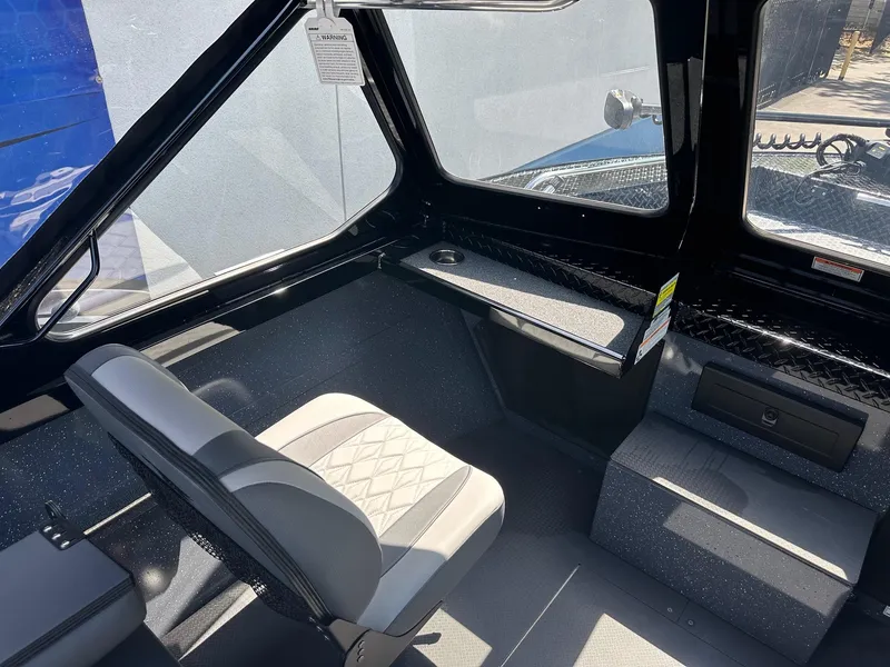 Slide: The Image of Interior of 2025 Duckworth 20 Advantage boat with seating and dashboard. - 13