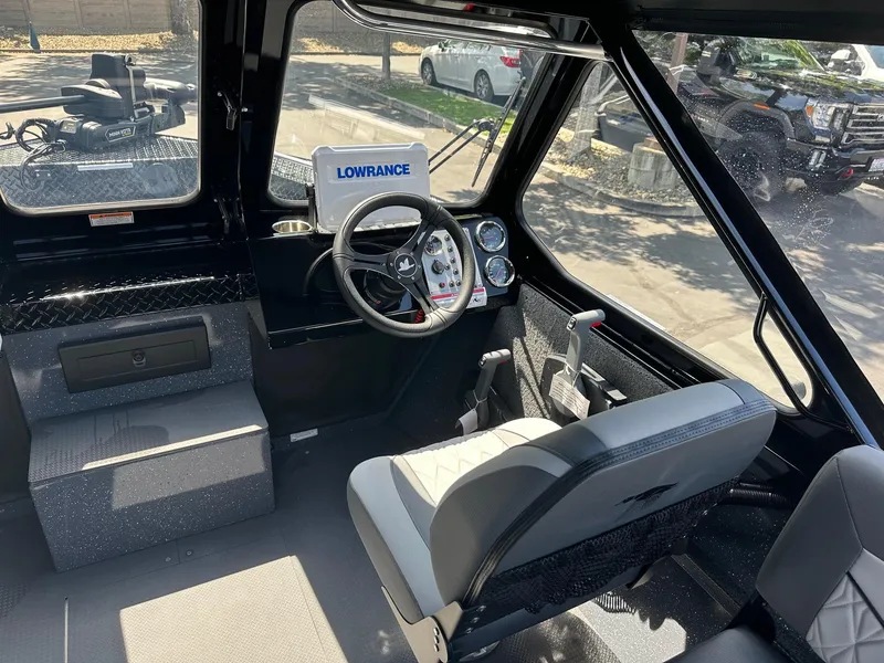 Slide: The Image of Interior of 2025 Duckworth 20 Advantage boat with steering wheel and Lowrance navigation system. - 14