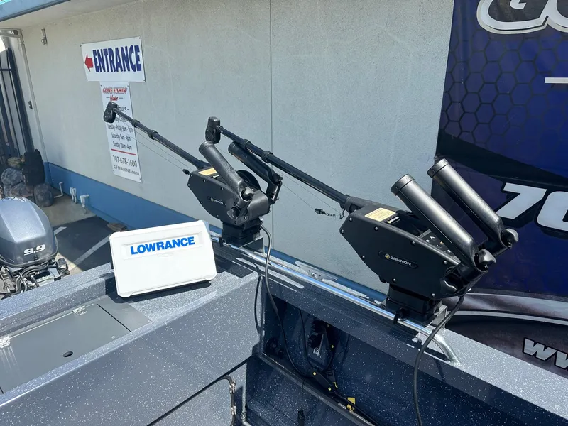 Slide: The Image of 2025 Duckworth 20 Advantage boat with Lowrance equipment and downriggers, parked near entrance sign. - 6