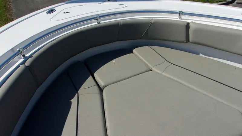 Slide: The Image of 2025 Sportsman Open 232 boat with cushioned seating area. - 13