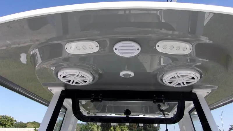 Slide: The Image of 2025 Sportsman Open 232 boat T-top with speakers and lights. - 15