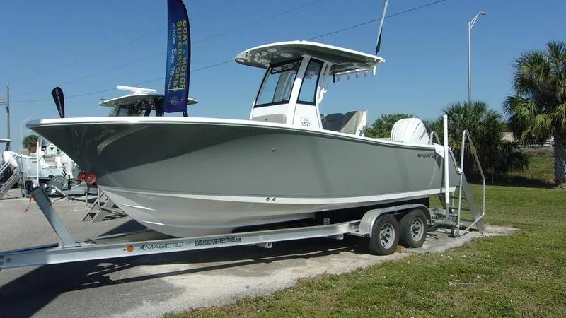Slide: The Image of 2025 Sportsman Open 232 boat on trailer, parked outdoors. - 2