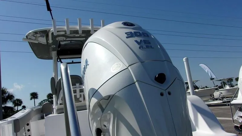 Slide: The Image of 2025 Sportsman Open 232 boat with powerful outboard motor, viewed from the rear. - 3