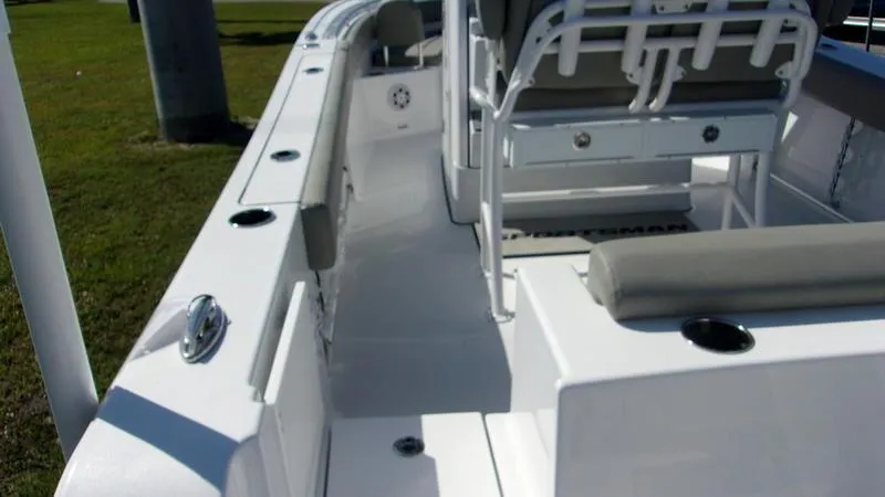 Slide: The Image of 2025 Sportsman Open 232 boat interior with seating and rod holders. - 4