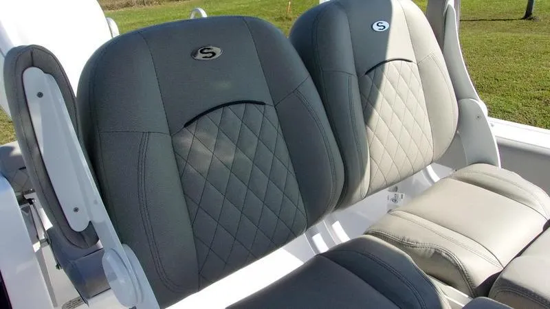 Slide: The Image of 2025 Sportsman Open 232 boat seats with quilted design and logo. - 9