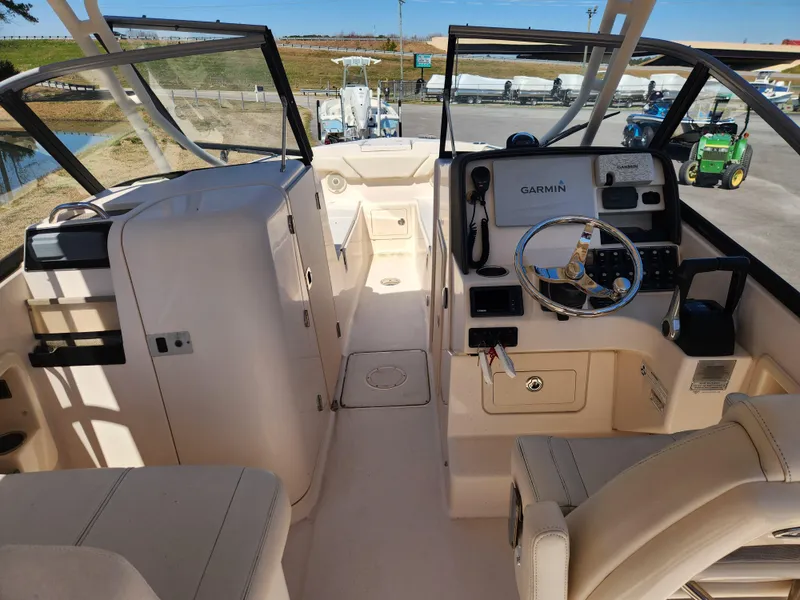 Slide: The Image of 2015 Grady-White Freedom 275 boat interior with Garmin navigation system. - 11