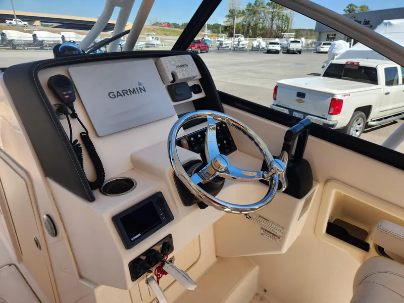 Slide: The Image of 2015 Grady-White Freedom 275 boat helm with Garmin navigation system. - 10