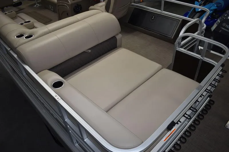 Slide: The Image of 2023 Sun Tracker Sportfish™ 24 XP3 boat interior with beige seating and cup holders. - 15