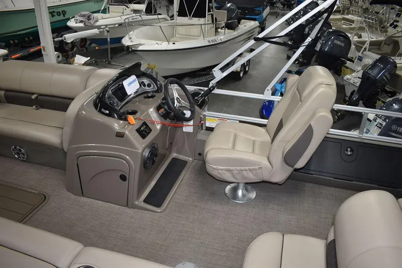 Slide: The Image of 2023 Sun Tracker Sportfish™ 24 XP3 pontoon boat interior with helm and seating. - 19
