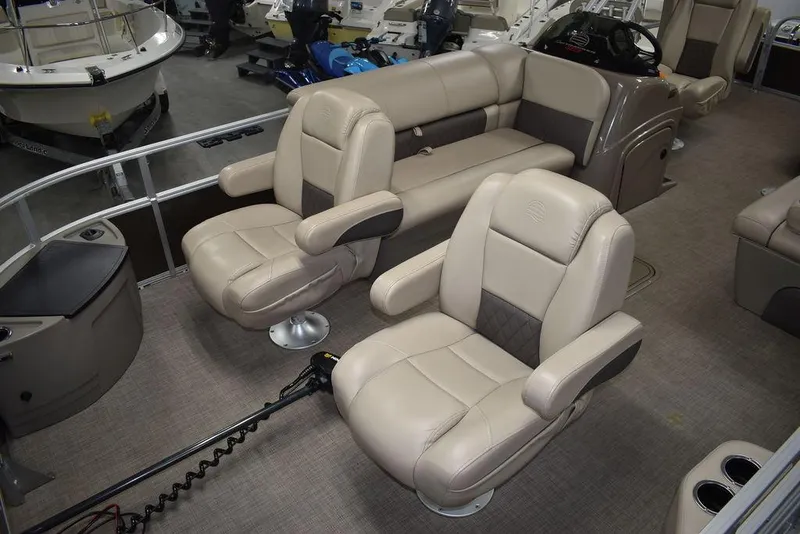 Slide: The Image of 2023 Sun Tracker Sportfish™ 24 XP3 boat interior with beige seating and modern design. - 25