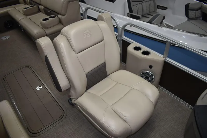 Slide: The Image of 2023 Sun Tracker Sportfish™ 24 XP3 interior with beige seating and cup holders. - 36