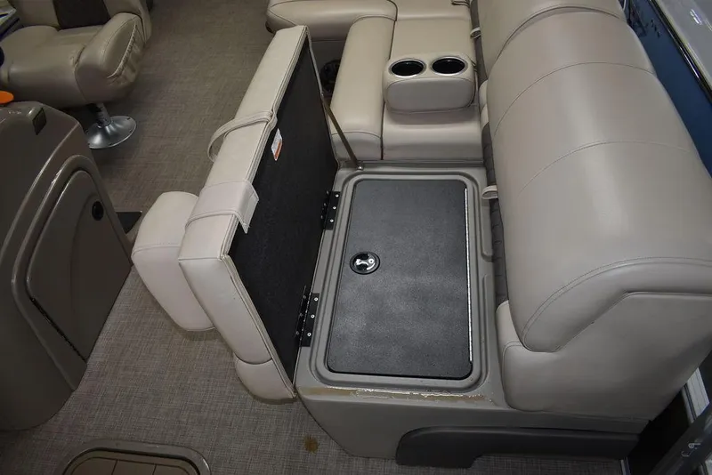 Slide: The Image of 2023 Sun Tracker Sportfish™ 24 XP3 boat interior with storage compartment and cup holders. - 45