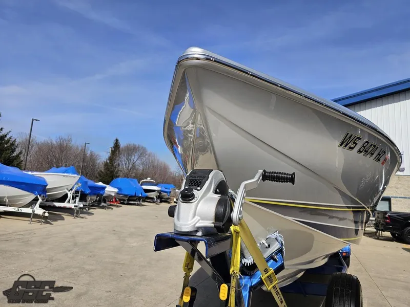 Slide: The Image of 2007 Outerlimits 39 Quattro boat on trailer in a marina with blue sky. - 11