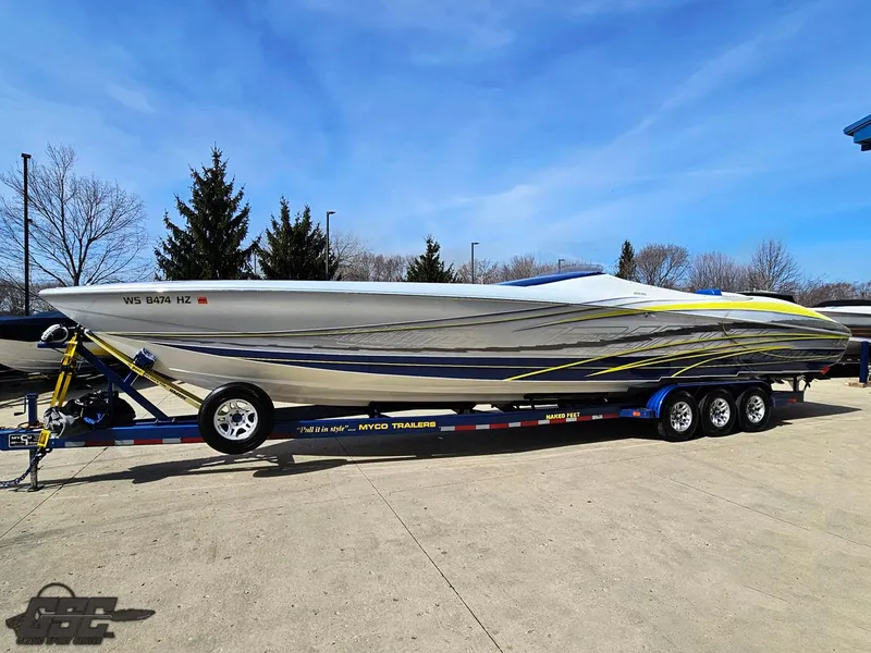 Slide: The Image of 2007 Outerlimits 39 Quattro powerboat on trailer, sleek design with vibrant accents. - 14