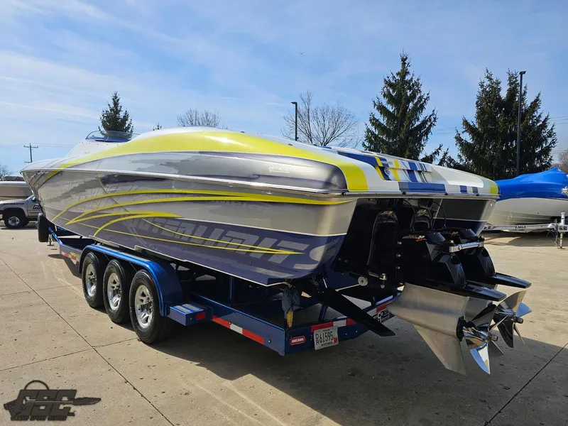 Slide: The Image of 2007 Outerlimits 39 Quattro speedboat on trailer, vibrant yellow and gray design. - 22