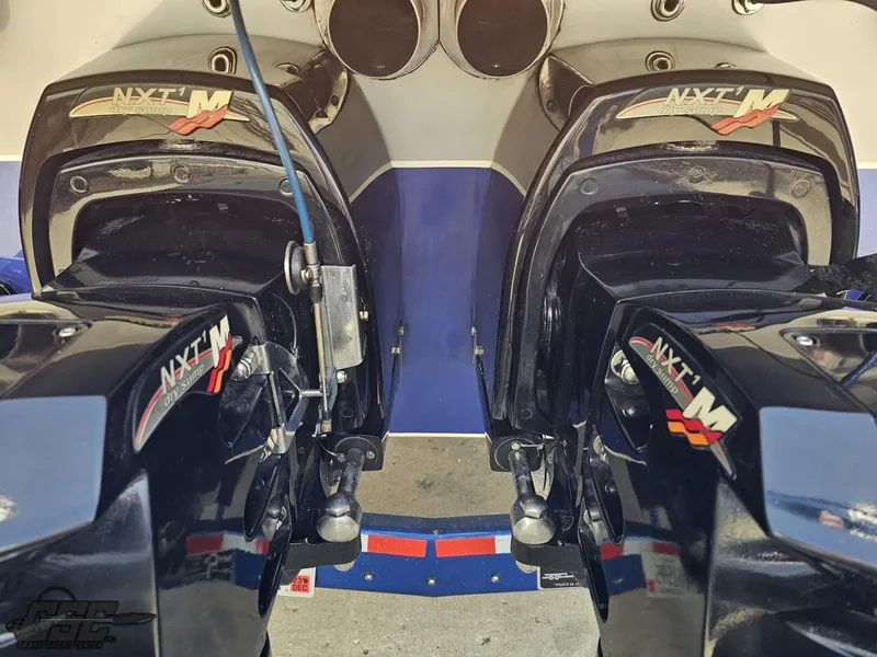Slide: The Image of Twin NXT drives on a 2007 Outerlimits 39 Quattro boat, showcasing powerful marine engineering. - 25