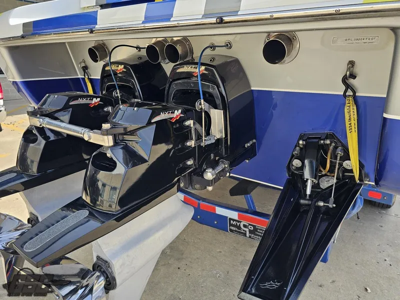 Slide: The Image of 2007 Outerlimits 39 Quattro boat with powerful engines and sleek blue design. - 26