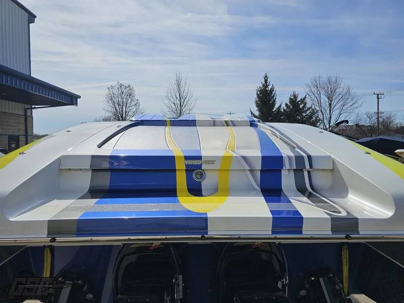 Slide: The Image of 2007 Outerlimits 39 Quattro boat with blue, yellow, and white stripes, rear view. - 28