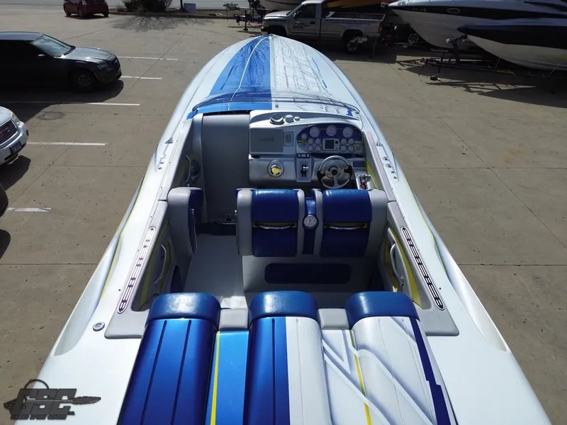 Slide: The Image of 2007 Outerlimits 39 Quattro boat interior with blue and white seating and dashboard. - 32