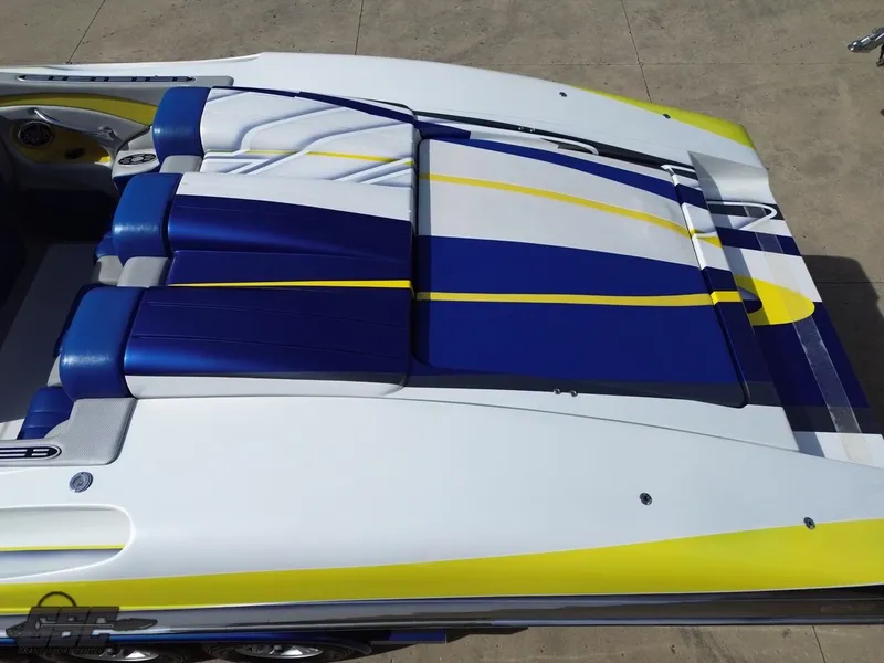 Slide: The Image of 2007 Outerlimits 39 Quattro boat with blue and yellow seating design. - 33