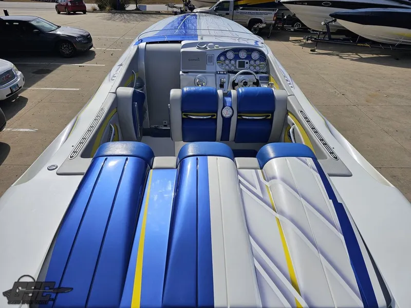 Slide: The Image of 2007 Outerlimits 39 Quattro boat interior with blue and white seating, dashboard view. - 44