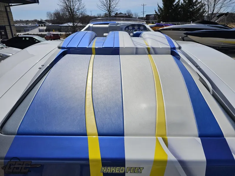 Slide: The Image of 2007 Outerlimits 39 Quattro boat with blue, yellow, and white stripes on deck. - 45