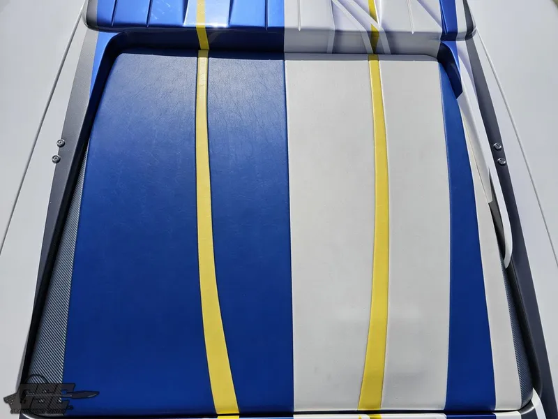 Slide: The Image of 2007 Outerlimits 39 Quattro boat seat with blue, white, and yellow stripes. - 46