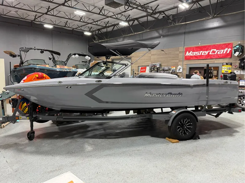 The Image of 2025 MasterCraft ProStar boat displayed indoors on a trailer. - 0