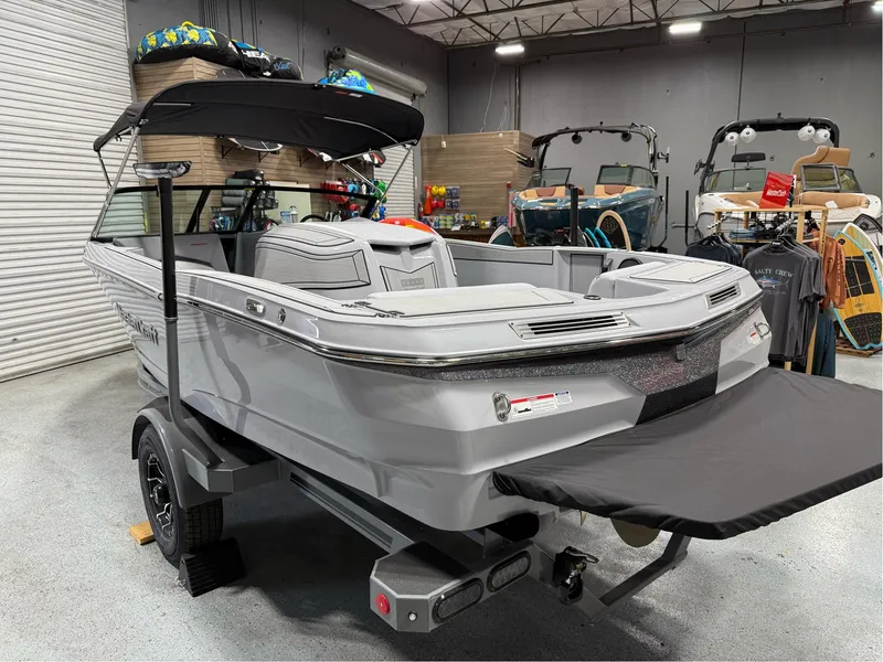 Slide: The Image of 2025 MasterCraft ProStar boat in showroom, featuring sleek design and modern amenities. - 3