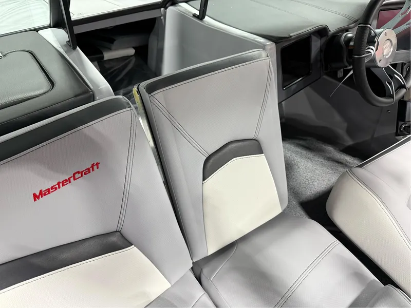 Slide: The Image of 2025 MasterCraft ProStar interior with sleek gray and white seating design. - 30