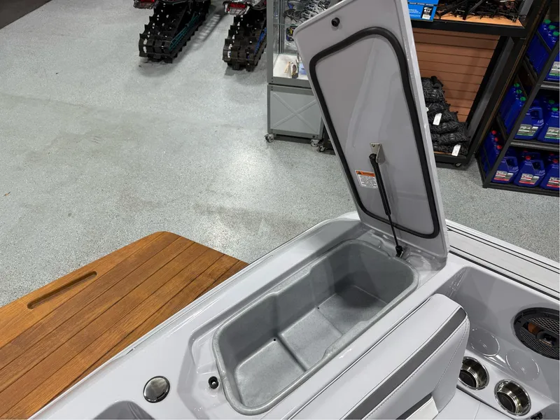 Slide: The Image of 2025 MasterCraft ProStar boat interior storage compartment open in showroom. - 32