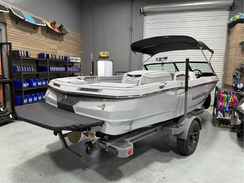 Slide: The Image of 2025 MasterCraft ProStar boat in showroom, featuring sleek design and modern amenities. - 5