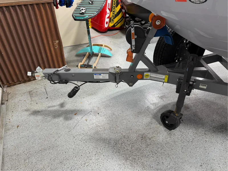 Slide: The Image of 2025 MasterCraft ProStar boat trailer hitch in a garage setting. - 9