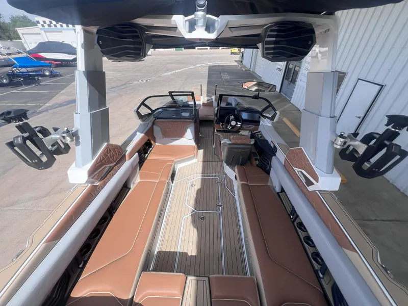 Slide: The Image of 2022 Nautique Super Air Nautique G25 Paragon interior with luxurious seating and advanced controls. - 10