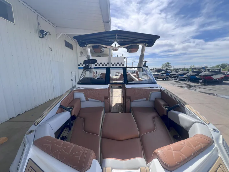 Slide: The Image of 2022 Nautique Super Air Nautique G25 Paragon interior with luxurious seating and open sky view. - 3